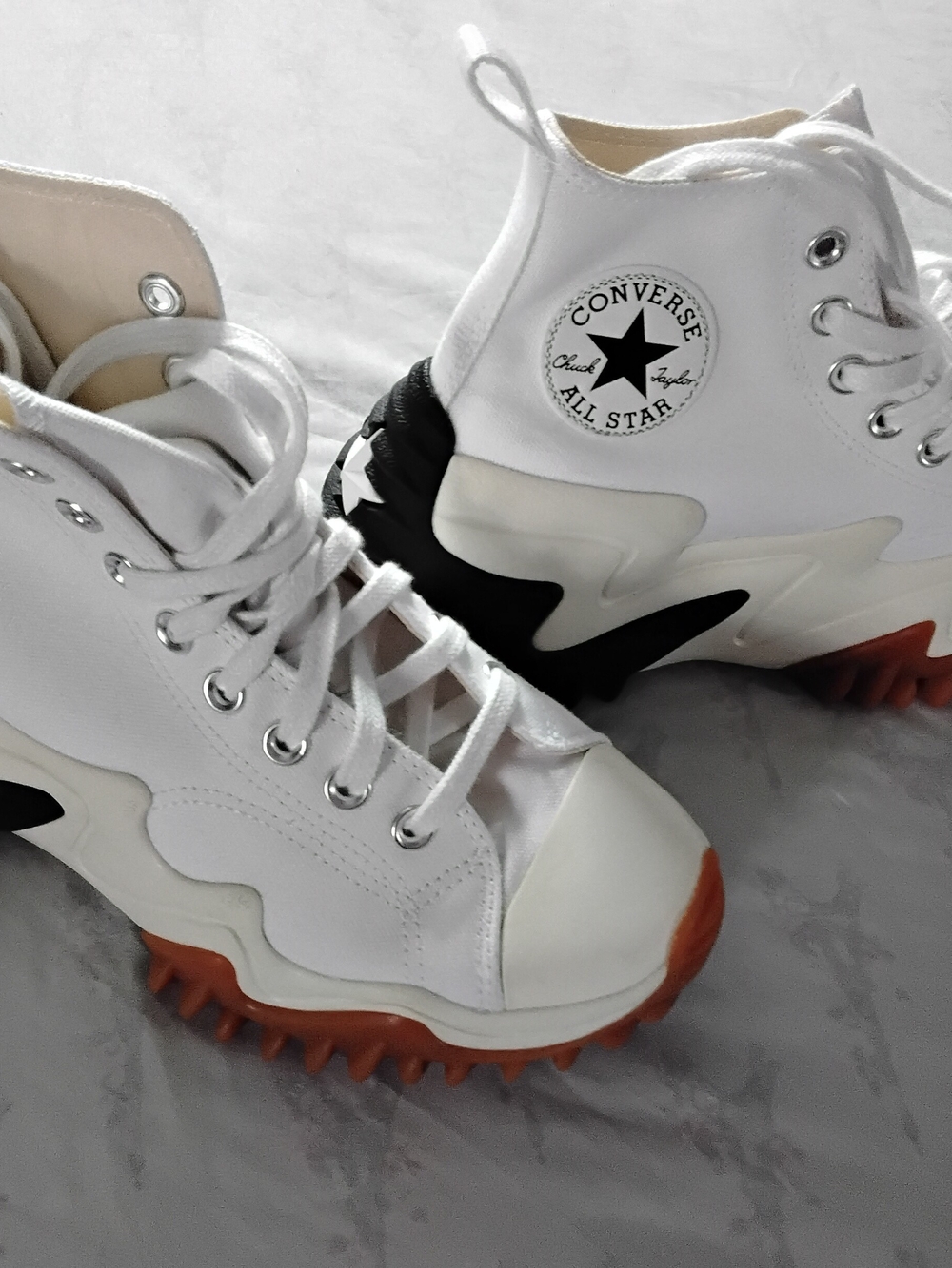 Converse White High-Top Platforms with Black Accents and Orange Outsoles